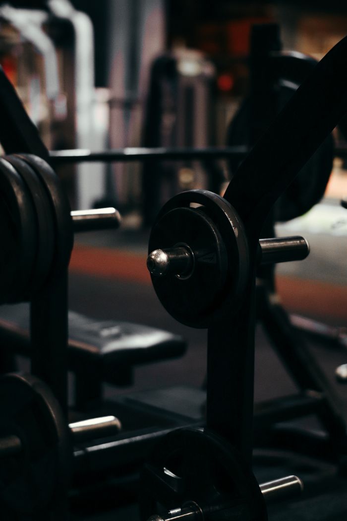 An up-close view of weightlifting equipment in a modern gym setting, perfect for fitness enthusiasts.